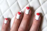 <p>Instead of a traditional French manicure that follows the natural arch of your nail, flip it around to create a half moon. Choose colors like red and white for the holiday (and use <a href="https://www.goodhousekeeping.com/beauty/nails/g33003945/best-gel-nail-polish/" rel="nofollow noopener" target="_blank" data-ylk="slk:gel nail polish;elm:context_link;itc:0;sec:content-canvas" class="link ">gel nail polish</a> for a long-lasting mani). </p>