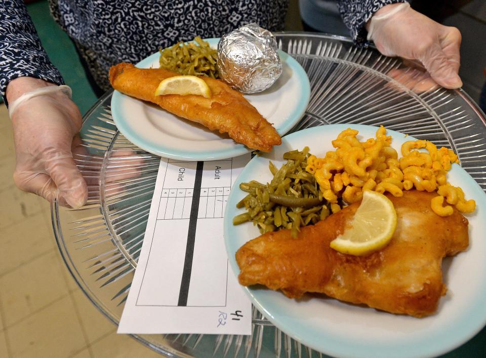 Two fried fish dinners are ready to be served during a Lenten fish dinner at Our Lady of the Lake Catholic Church in Edinboro in 2018. Numerous churches in the Erie region are offering the Lenten meals this year.