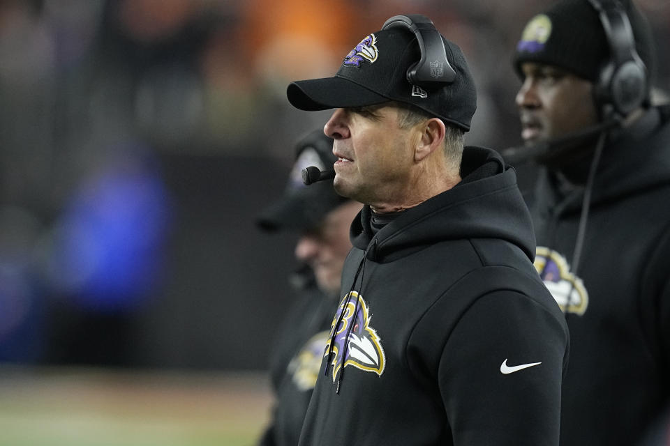 John Harbaugh, head coach of the Baltimore Ravens, watches from the sidelines in the second half of an NFL playoff game against the Cincinnati Bengals in Cincinnati, Sunday, Jan. 15, 2023. (AP Photo/Darron Cummings)