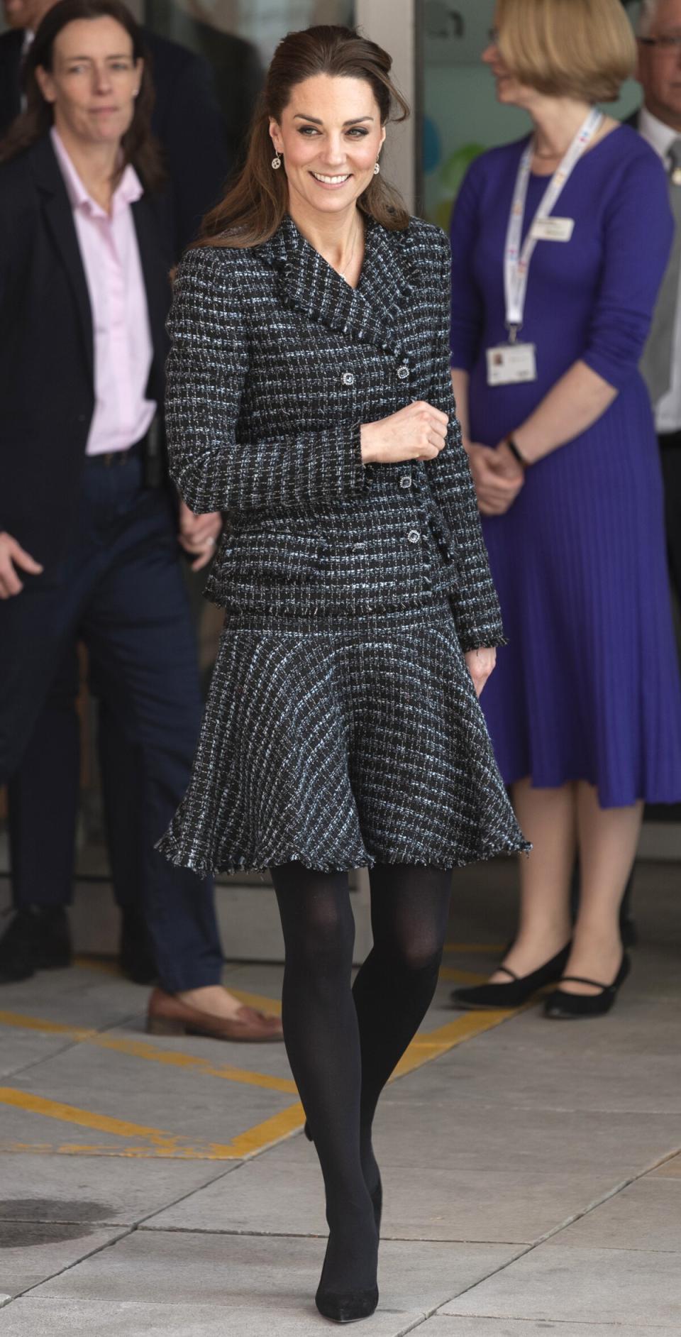 The Duchess of Cambridge <a href="https://people.com/royals/kate-middleton-visits-childrens-hospital-to-teach-kids-one-of-her-favorite-hobbies-photography/" rel="nofollow noopener" target="_blank" data-ylk="slk:joined a creative workshop run by the National Portrait Gallery’s Hospital Programme;elm:context_link;itc:0;sec:content-canvas" class="link ">joined a creative workshop run by the National Portrait Gallery’s Hospital Programme</a> at the Evelina London Children’s Hospital to help teach children about photography. For her visit, Kate wore a black and grey tweed <a href="https://click.linksynergy.com/deeplink?id=93xLBvPhAeE&mid=1237&murl=https%3A%2F%2Fshop.nordstrom.com%2Fbrands%2Fdolcegabbana--4944&u1=PEO%2CShopping%3AEverythingYouNeedtoCopyKateMiddleton%E2%80%99sChicWinterStyle%2Ckamiphillips2%2CUnc%2CGal%2C7360903%2C202002%2CI" rel="nofollow noopener" target="_blank" data-ylk="slk:Dolce & Gabbana;elm:context_link;itc:0;sec:content-canvas" class="link ">Dolce & Gabbana</a> skirt suit and black pumps. <strong>Get the Look!</strong> MakeMeChic Two Piece Slim Fit Suit Frayed Tweed Blazer and Skirt Set, $28.99–$35.99; <a href="https://www.amazon.com/MAKEMECHIC-Womens-Frayed-Blazer-2-Multi/dp/B07THXK9YN/ref=as_li_ss_tl?ie=UTF8&linkCode=ll1&tag=poamzfkatemiddletonwinterstylekphillips120-20&linkId=9c0e88a158faa2e89fa965fad3f456ce&language=en_US" rel="nofollow noopener" target="_blank" data-ylk="slk:amazon.com;elm:context_link;itc:0;sec:content-canvas" class="link ">amazon.com</a> Calvin Klein Collarless Tweed Jacket, $79.99 (orig. $139); <a href="https://click.linksynergy.com/deeplink?id=93xLBvPhAeE&mid=3184&murl=https%3A%2F%2Fwww.macys.com%2Fshop%2Fproduct%2Fcalvin-klein-collarless-tweed-jacket%3FID%3D10172326&u1=PEO%2CShopping%3AEverythingYouNeedtoCopyKateMiddleton%E2%80%99sChicWinterStyle%2Ckamiphillips2%2CUnc%2CGal%2C7360903%2C202002%2CI" rel="nofollow noopener" target="_blank" data-ylk="slk:macys.com;elm:context_link;itc:0;sec:content-canvas" class="link ">macys.com</a>; Calvin Klein Sequined Tweed Skirt, $53.40 (orig. $89); <a href="https://click.linksynergy.com/deeplink?id=93xLBvPhAeE&mid=3184&murl=https%3A%2F%2Fwww.macys.com%2Fshop%2Fproduct%2Fcalvin-klein-sequined-tweed-skirt%3FID%3D10172343&u1=PEO%2CShopping%3AEverythingYouNeedtoCopyKateMiddleton%E2%80%99sChicWinterStyle%2Ckamiphillips2%2CUnc%2CGal%2C7360903%2C202002%2CI" rel="nofollow noopener" target="_blank" data-ylk="slk:macys.com;elm:context_link;itc:0;sec:content-canvas" class="link ">macys.com</a> Julia Jordan Long Sleeve Mock Two-Piece Tweed Dress, $149; <a href="https://click.linksynergy.com/deeplink?id=93xLBvPhAeE&mid=1237&murl=https%3A%2F%2Fshop.nordstrom.com%2Fs%2Fjulia-jordan-long-sleeve-mock-two-piece-tweed-dress%2F5518247%2Ffull&u1=PEO%2CShopping%3AEverythingYouNeedtoCopyKateMiddleton%E2%80%99sChicWinterStyle%2Ckamiphillips2%2CUnc%2CGal%2C7360903%2C202002%2CI" rel="nofollow noopener" target="_blank" data-ylk="slk:nordstrom.com;elm:context_link;itc:0;sec:content-canvas" class="link ">nordstrom.com</a> Asos Design Mono Boucle Cropped Suit Blazer, $31 (orig. $87); <a href="https://click.linksynergy.com/deeplink?id=93xLBvPhAeE&mid=35719&murl=https%3A%2F%2Fwww.asos.com%2Fus%2Fasos-design%2Fasos-design-mono-boucle-suit%2Fgrp%2F25639&u1=PEO%2CShopping%3AEverythingYouNeedtoCopyKateMiddleton%E2%80%99sChicWinterStyle%2Ckamiphillips2%2CUnc%2CGal%2C7360903%2C202002%2CI" rel="nofollow noopener" target="_blank" data-ylk="slk:asos.com;elm:context_link;itc:0;sec:content-canvas" class="link ">asos.com</a>; Asos Design Mono Boucle Mini Suit Skirt, $26 (orig. $40); <a href="https://click.linksynergy.com/deeplink?id=93xLBvPhAeE&mid=35719&murl=https%3A%2F%2Fwww.asos.com%2Fus%2Fasos-design%2Fasos-design-mono-boucle-suit%2Fgrp%2F25639&u1=PEO%2CShopping%3AEverythingYouNeedtoCopyKateMiddleton%E2%80%99sChicWinterStyle%2Ckamiphillips2%2CUnc%2CGal%2C7360903%2C202002%2CI" rel="nofollow noopener" target="_blank" data-ylk="slk:asos.com;elm:context_link;itc:0;sec:content-canvas" class="link ">asos.com</a> Julia Jordan Tweed A-Line Jacket Dress, $79.99 (orig. $149); <a href="https://click.linksynergy.com/deeplink?id=93xLBvPhAeE&mid=3184&murl=https%3A%2F%2Fwww.macys.com%2Fshop%2Fproduct%2Fjulia-jordan-tweed-a-line-jacket-dress%3FID%3D10189285&u1=PEO%2CShopping%3AEverythingYouNeedtoCopyKateMiddleton%E2%80%99sChicWinterStyle%2Ckamiphillips2%2CUnc%2CGal%2C7360903%2C202002%2CI" rel="nofollow noopener" target="_blank" data-ylk="slk:macys.com;elm:context_link;itc:0;sec:content-canvas" class="link ">macys.com</a> Fashion Union Blazer in Mixed Check Two-Piece, $83; <a href="https://click.linksynergy.com/deeplink?id=93xLBvPhAeE&mid=35719&murl=https%3A%2F%2Fwww.asos.com%2Fus%2Ffashion-union%2Ffashion-union-blazer-in-mixed-check-two-piece%2Fprd%2F13647891&u1=PEO%2CShopping%3AEverythingYouNeedtoCopyKateMiddleton%E2%80%99sChicWinterStyle%2Ckamiphillips2%2CUnc%2CGal%2C7360903%2C202002%2CI" rel="nofollow noopener" target="_blank" data-ylk="slk:asos.com;elm:context_link;itc:0;sec:content-canvas" class="link ">asos.com</a>; Fashion Union Skirt in Mixed Check Two-Piece, $51; <a href="https://click.linksynergy.com/deeplink?id=93xLBvPhAeE&mid=35719&murl=https%3A%2F%2Fwww.asos.com%2Fus%2Ffashion-union%2Ffashion-union-skirt-in-mixed-check-two-piece%2Fprd%2F13647910&u1=PEO%2CShopping%3AEverythingYouNeedtoCopyKateMiddleton%E2%80%99sChicWinterStyle%2Ckamiphillips2%2CUnc%2CGal%2C7360903%2C202002%2CI" rel="nofollow noopener" target="_blank" data-ylk="slk:asos.com;elm:context_link;itc:0;sec:content-canvas" class="link ">asos.com</a>
