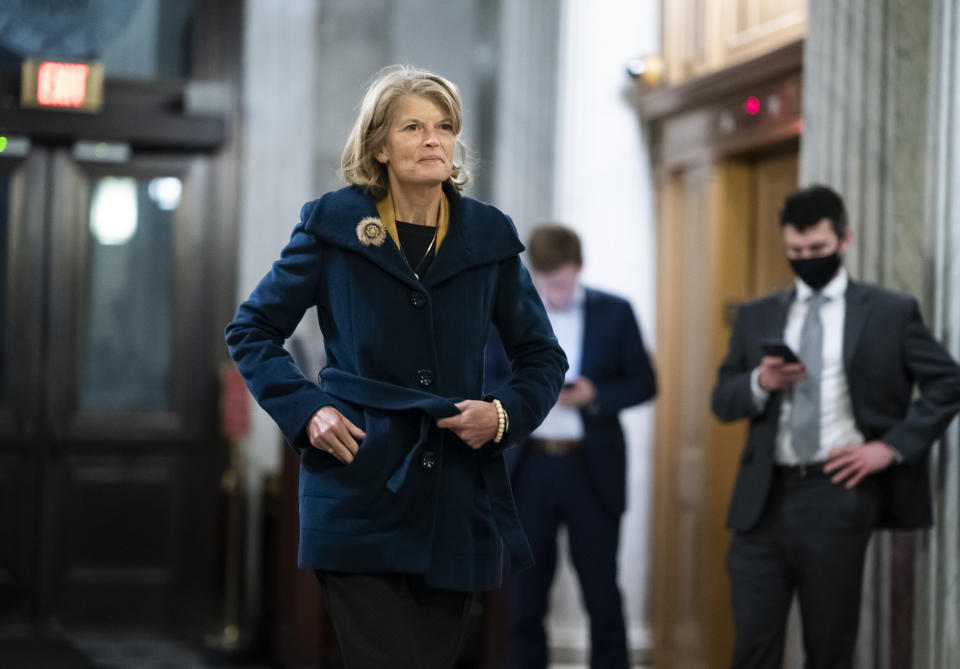 FILE - Sen. Lisa Murkowski, R-Alaska, arrives at the Capitol in Washington, on Dec. 2, 2021, to vote on an appropriations bill that funds the government through Feb. 18, 2022, and avoids a short-term shutdown. Former President Donald Trump said he would endorse Alaska Gov. Mike Dunleavy for reelection, but only if the governor doesn't back Murkowski's bid to return to the Senate. (AP Photo/J. Scott Applewhite, File)
