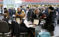 FILE PHOTO: Passengers get registered at Kiev's main airport, Boryspil, in Ukraine, January 18, 2015. REUTERS/Valentyn Ogirenko/File Photo