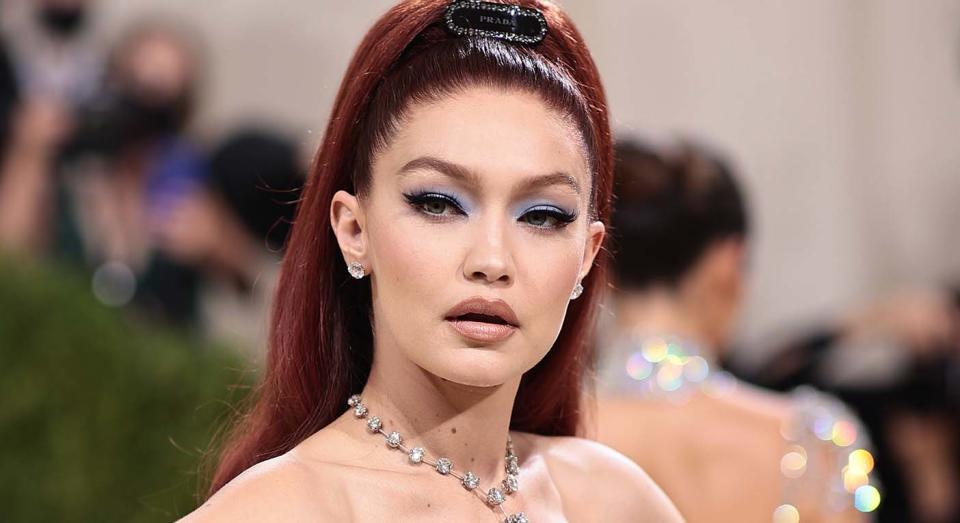 Gigi Hadid opts for Prada dress and accessories, Chopard jewellery, but Maybelline concealer for the 2021 Met Gala.  (Getty Images)