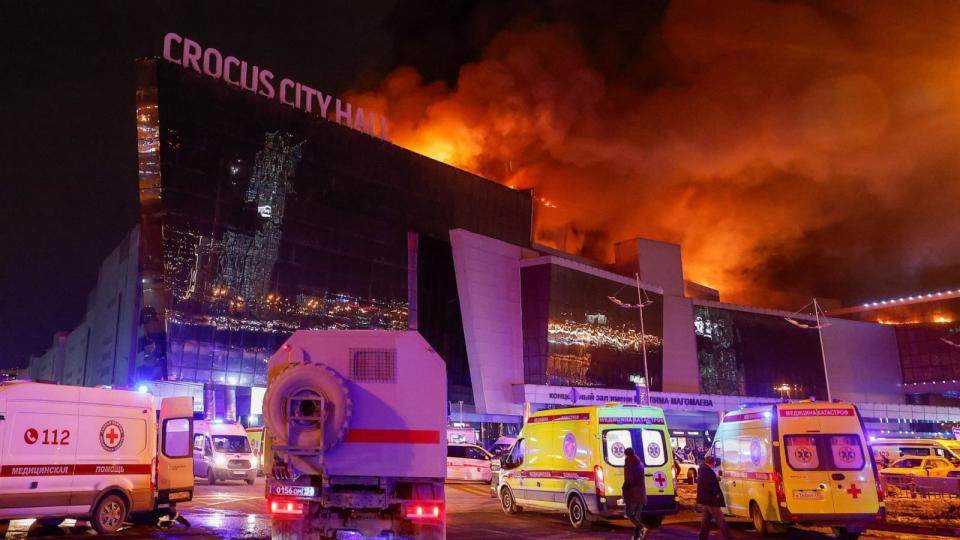 PHOTO: Vehicles of Russian emergency services are parked near the burning Crocus City Hall concert venue following a reported shooting incident, outside Moscow, March 22, 2024.  (Maxim Shemetov/Reuters)