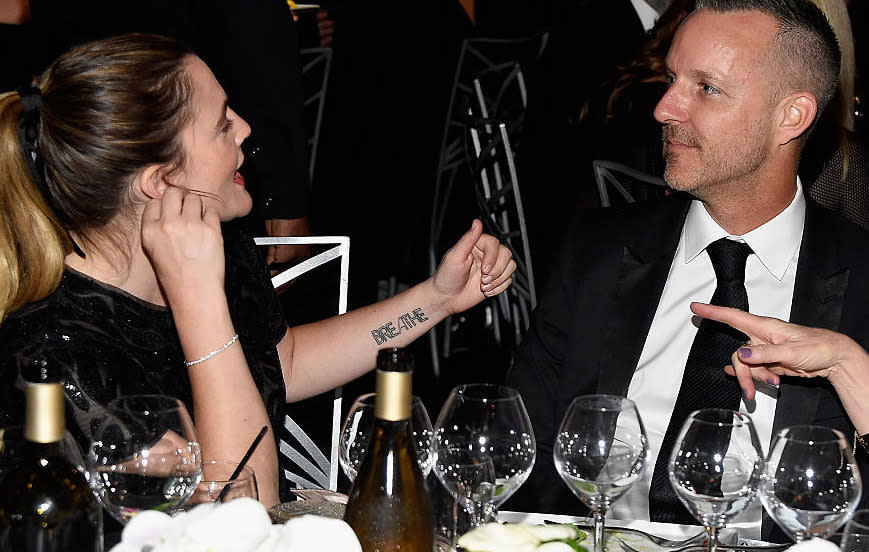 Drew Barrymore has ‘BREATHE’ across her forearm. We feel ya, Drew.