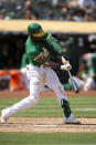 Oakland Athletics' Starling Marte (2) connects for a single against the Texas Rangers during the sixth inning of a baseball game, his fourth hit of the contest, Sunday, Aug. 8, 2021, in Oakland, Calif. (AP Photo/D. Ross Cameron)