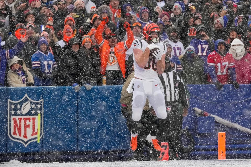 Cincinnati Bengals tight end Hayden Hurst (88) catches a pass in the end zone for a touchdown in the first quarter of the NFL divisional playoff football game between the Cincinnati Bengals and the Buffalo Bills, Sunday, Jan. 22, 2023, at Highmark Stadium in Orchard Park, N.Y. The Bengals led 17-7 at halftime.