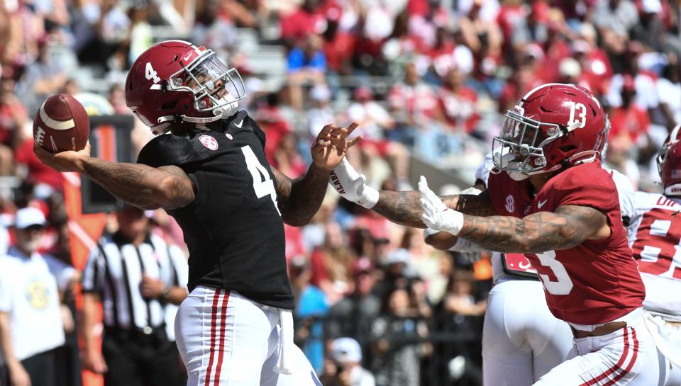 Apr 22, 2023; Tuscaloosa, AL, USA;  White team quarterback Jalen Milroe (4) throws a pass as he is pressured by Crimson team defensive back Malachi Moore (13) at Bryant-Denny Stadium. 