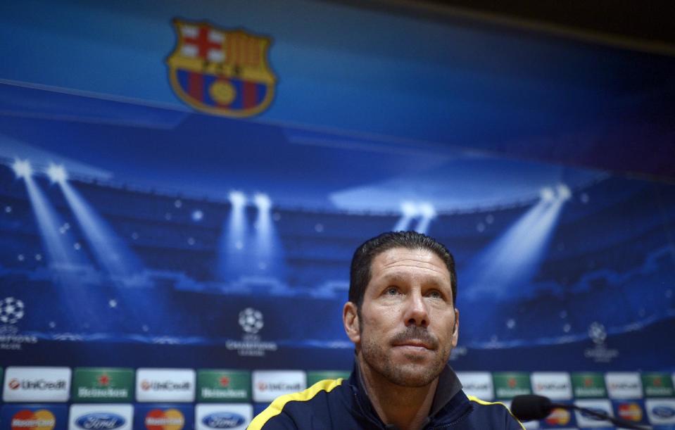Atletico Madrid's Diego Pablo Simeone, from Argentina, attends a press conference at the Camp Nou stadium in Barcelona, Spain, Monday, March 31, 2014. FC Barcelona will face Atletico Madrid in a first leg quarter-final Champions League soccer match upcoming April 1. (AP Photo/Manu Fernandez)