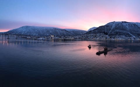 Sunrise as a submarine surfaces in Tromso - Credit: Sarah Knapton