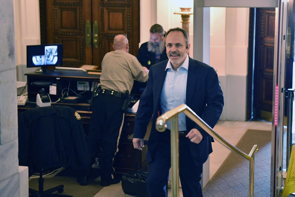 Former Kentucky Governor Matt Bevin passes through security at the Kentucky State Capitol in Frankfort, Ky., Friday, Jan. 6, 2023. Bevin spoke to reporter in the Rotunda and had hinted that he would declare his candidacy for the office of Governor in the Republican primary, but after his speech he left the Capitol without filing. (AP Photo/Timothy D. Easley)
