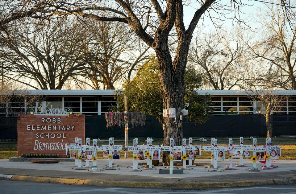 Crosses stand outside Uvalde's Robb Elementary School as a memorial to the 19 children and two teachers killed in the May 24, 2022, mass shooting. A Uvalde County grand jury has subpoenaed multiple law enforcement officers who responded to the attack.