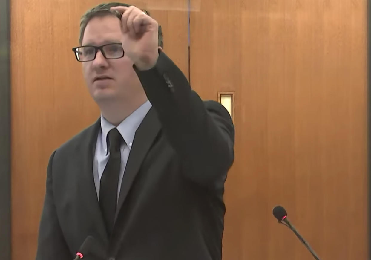 In this screen grab from video, Assistant Attorney General Joshua Larson, questions a witness as Hennepin County Judge Regina Chu presides over court Monday, Dec. 13, 2021, in the trial of former Brooklyn Center police Officer Kim Potter in the April 11, 2021, death of Daunte Wright, at the Hennepin County Courthouse in Minneapolis, Minn. (Court TV via AP, Pool)