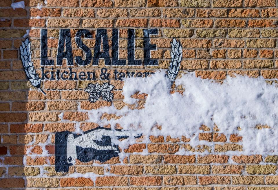 In this 2019 Tribune file photo, a sign directs customers towards LaSalle Kitchen and Tavern entrance in downtown South Bend.