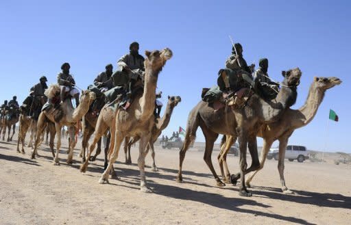 Polisario Front rebel soldiers parade during a ceremony marking the 35th anniversary of the proclamation of independence of the Sahrawi Arab Democratic Republic on February 27 in the Western Sahara village of Tifariti. Peace efforts between Morocco and Western Sahara rebels have hit a deadlock with a UN envoy unable to organize new talks between the rivals, diplomats said