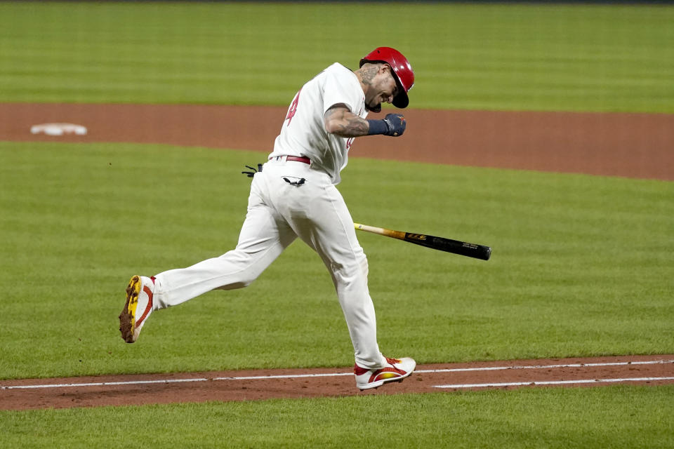 St. Louis Cardinals' Yadier Molina celebrates after hitting a single for his 2,000th career hit during the seventh inning of a baseball game against the Milwaukee Brewers Thursday, Sept. 24, 2020, in St. Louis. (AP Photo/Jeff Roberson)