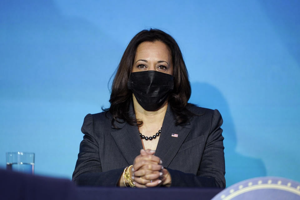 Vice President-elect Kamala Harris listens as President-elect Joe Biden announces their climate and energy team nominees and appointees at The Queen Theater in Wilmington Del., Saturday, Dec. 19, 2020. (AP Photo/Carolyn Kaster)