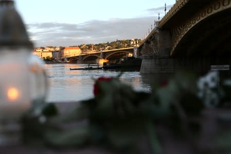 A military ship is seen near the site of a ship accident, which killed several people, on the Danube river in Budapest