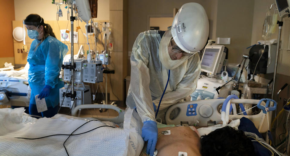 Medical staff look after patients in a Covid ward.