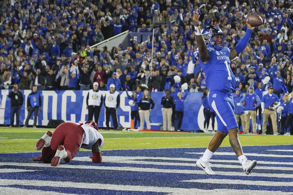 Kentucky quarterback Lynn Bowden Jr. (1) celebrates after scoring a touchdown in the first half of the team's NCAA college football game against Arkansas, Saturday, Oct. 12, 2019, in Lexington, Ky. (AP Photo/Bryan Woolston)