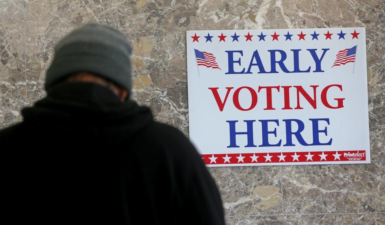 A man checks  in for  early voting  on Tuesday, March 21, 2023 at the Frank P. Zeidler Municipal Building at 841 North Broadway in downtown Milwaukee. The 2023 Wisconsin spring general election is April 4. The election will determine a new justice on the Supreme Court as well as other local, nonpartisan offices.