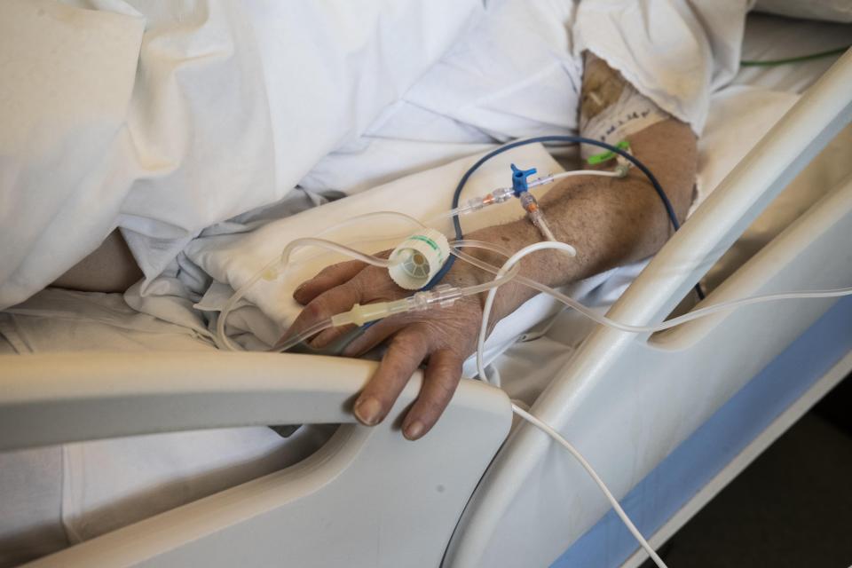 A patient under treatment lies on a bed in the emergency COVID-19 ward at the Mellino Mellini hospital in Chiari, northern Italy, Monday, March 8, 2021. The 160-bed hospital in the Po River Valley town of Chiari has no more beds for patients stricken with the highly contagious variant of COVID-19 first identified in Britain, and which now has put hospitals in Italy’s northern Brescia province on high alert. (AP Photo/Luca Bruno)