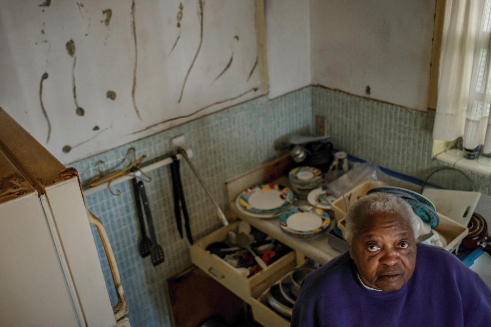 92-year-old Catherine Rosendary at her home in Riviera Beach, Fla, on Tuesday, November 9, 2021. Termite infestation forced her to rip out the cabinetry to save the house.