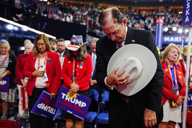 Convention attendees pray at Fiserv Forum on Sunday, July 15, 2024, at the RNC in Milwaukee, Wisconsin.