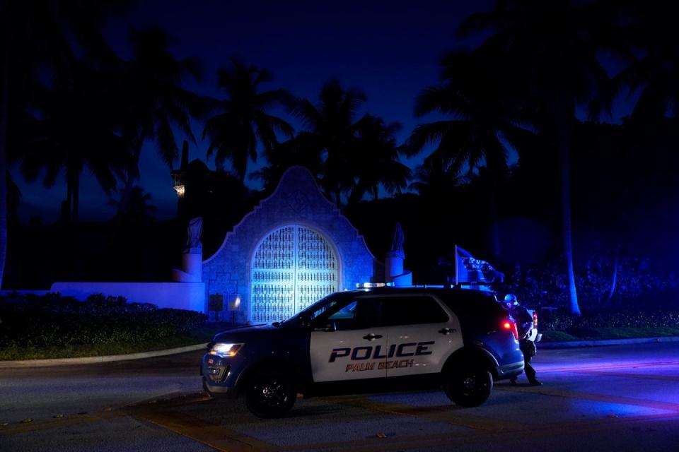 Police stand outside an entrance to former President Donald Trump's Mar-a-Lago estate, Monday, Aug. 8, 2022, in Palm Beach, Fla. Trump said in a lengthy statement that the FBI was conducting a search of his Mar-a-Lago estate and asserted that agents had broken open a safe. (AP Photo/Wilfredo Lee) (Copyright 2022 The Associated Press. All rights reserved)