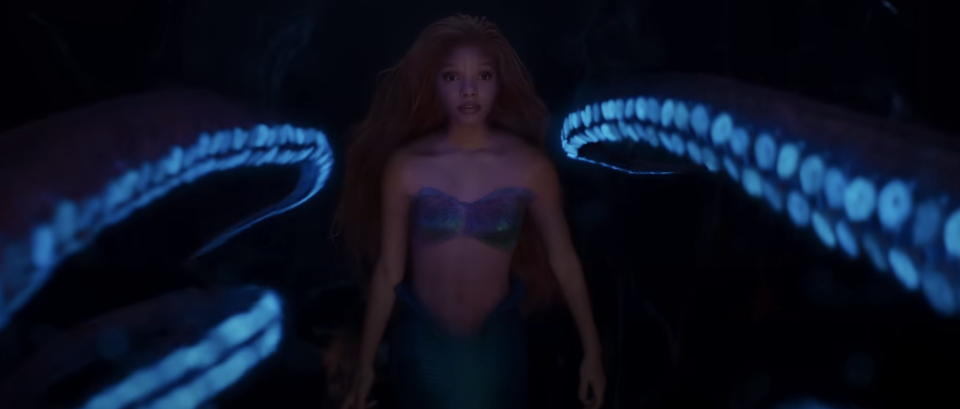 Ariel facing several glowing octopus tentacles