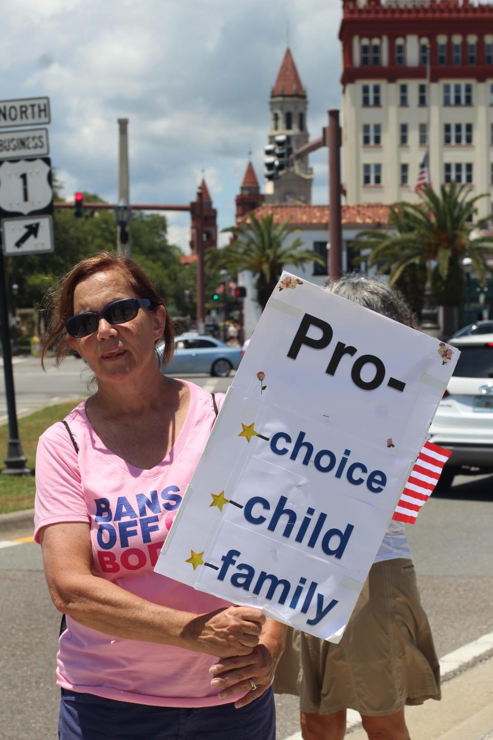 Hazel Robinson holds a sign during a pro-choice rally Saturday, May 14, 2022, at the Bridge of Lions in St. Augustine. "I am here because I don't want the government to control our choice and I want to protect women's reproductive rights," Robinson said.