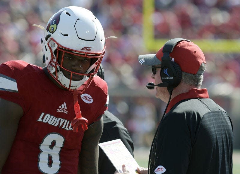 Louisville head coach Bobby Petrino, right, talks with quarterback Lamar Jackson (8)against Boston College, in Louisville, Ky. last Saturday. Boston College won 45-42. Toss out automatic wins against Kent State and Murray State and Louisville is 2-3 against Power Five competition, after finishing last season with three straight losses.AP Photo/TIMOTHY D. EASLEY