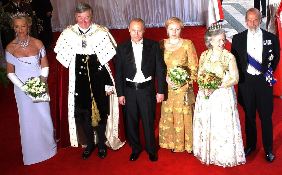 President of Russia Vladimir Putin and his wife Lyudmila (centre) are greeted by The Lord Mayor of London Gavyn Arthur and the Lady Mayoress Carole Blackshaw (left) and Prince and Princess Michael of Kent (right) on their arrival for the Lord Mayor's banquet at the Guildhall.