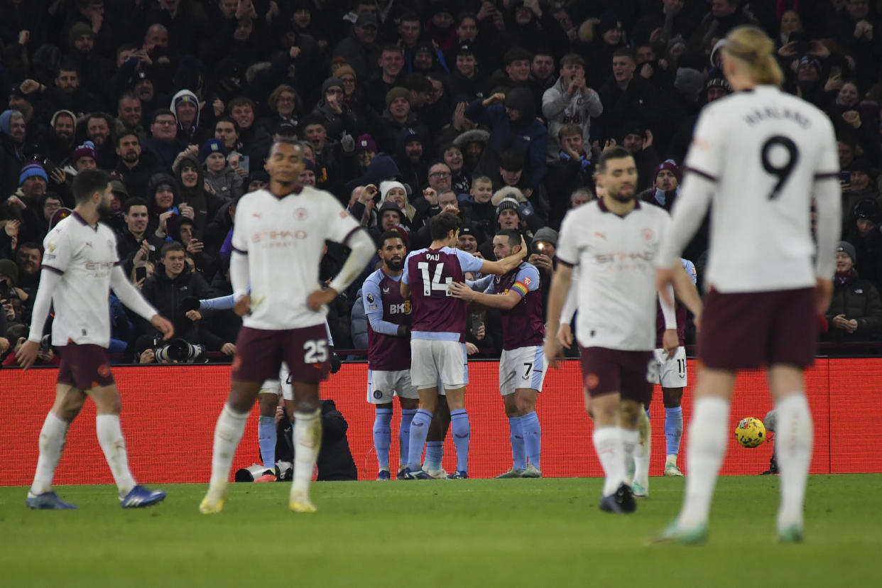 Aston Villa's Leon Bailey celebrates with teammates after scoring during the English Premier League soccer match between Aston Villa and Manchester City at Villa Park in Birmingham, England, Wednesday, Dec. 6, 2023. (AP Photo/Rui Vieira)