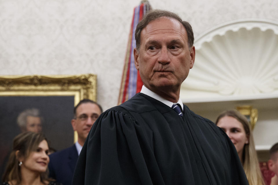Supreme Court Justice Samuel Alito pauses after swearing in Mark Esper as Secretary of Defense during a ceremony with President Donald Trump in the Oval Office at the White House in Washington, Tuesday, July 23, 2019. (AP Photo/Carolyn Kaster)