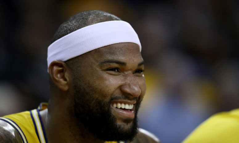 A closeup of DeMarcus Cousins laughing during a game.