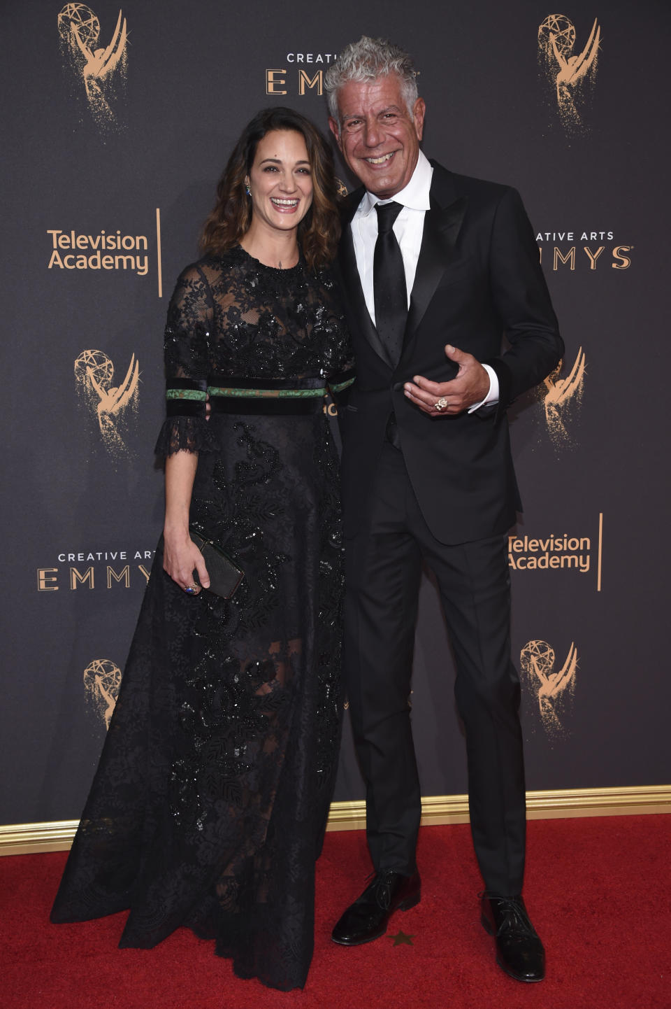 Asia Argento, left, and Anthony Bourdain arrive at night one of the Television Academy's 2017 Creative Arts Emmy Awards at the Microsoft Theater on Saturday, Sept. 9, 2017, in Los Angeles. (Photo by Phil McCarten/Invision for the Television Academy/AP Images)