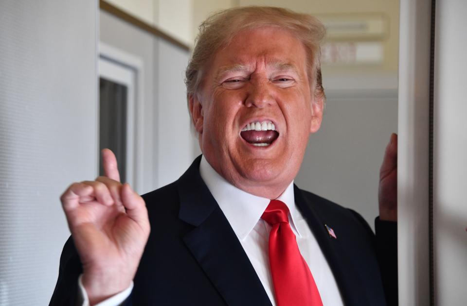 TOPSHOT - US President Donald Trump speaks to the press aboard Air Force One on September 7, 2018, as he travels to Fargo, North Dakota, to speak at a Joint Fundraising Committee. (Photo by Nicholas Kamm / AFP)NICHOLAS KAMM/AFP/Getty Images ORIG FILE ID: AFP_18X75M