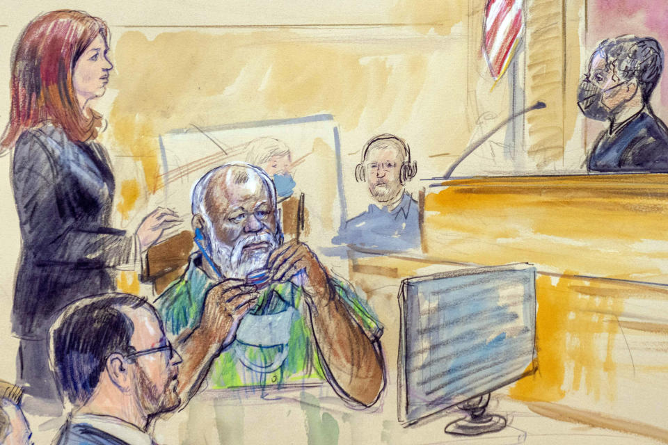 The artist sketch depicts Assistant U.S. Attorney Erik Kenerson, front left, watching as Whitney Minter, a public defender from the eastern division of Virginia, stands to represent Abu Agila Mohammad Mas'ud Kheir Al-Marimi, accused of making the bomb that brought down Pan Am Flight 103 over Lockerbie, Scotland, in 1988, in federal court in Washington, Monday, Dec. 12, 2022, as Magistrate Judge Robin Meriweather listens. (Dana Verkouteren via AP)