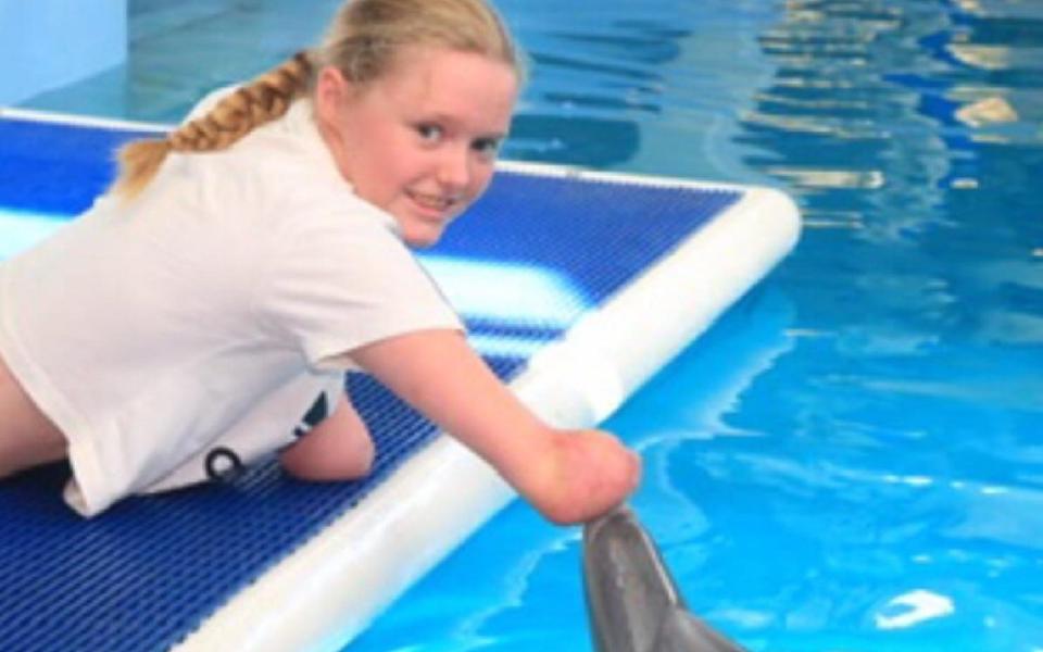 Miss Challis met Winter the dolphin after being inspired by her story