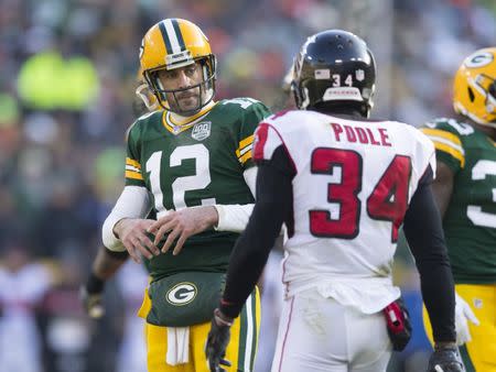 FILE PHOTO: Dec 9, 2018; Green Bay, WI, USA; Green Bay Packers quarterback Aaron Rodgers (12) reacts following a bit by Atlanta Falcons cornerback Brian Poole (34) during the second quarter at Lambeau Field. Mandatory Credit: Jeff Hanisch-USA TODAY Sports