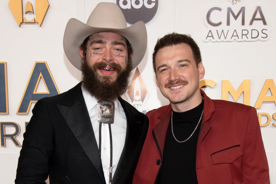 <p>Scott Kirkland/Disney via Getty</p> Post Malone and Morgan Wallen at the CMA Awards in Nashville in November 2023