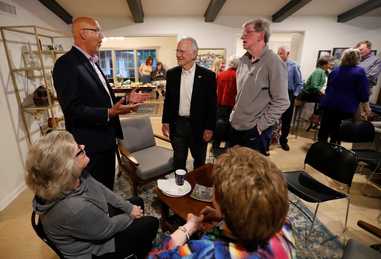 From left, mayoral candidate Mark McBrayer talks with retired judge Phil Johnson, and Ed Mooney talk after the voting closed. Candidates were monitoring the election results at various watch parties on Saturday, May 4, 2024.