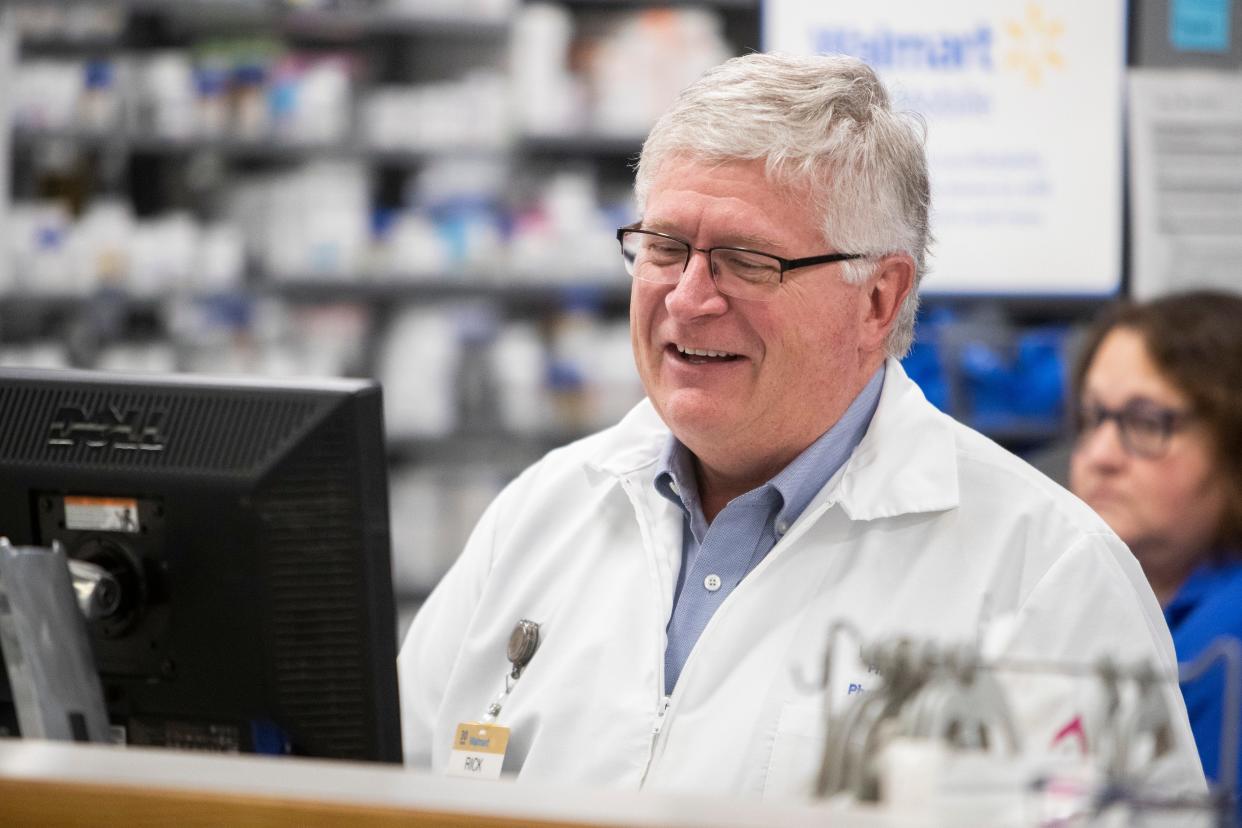 Rick Powers, the pharmacy manager at the Walmart Pharmacy in Collierville, smiles as he works at a computer in the pharmacy in Collierville, Tenn., on Wednesday, January 24, 2024. Powers started at the pharmacy in 1990 and is the only manager the location has had.