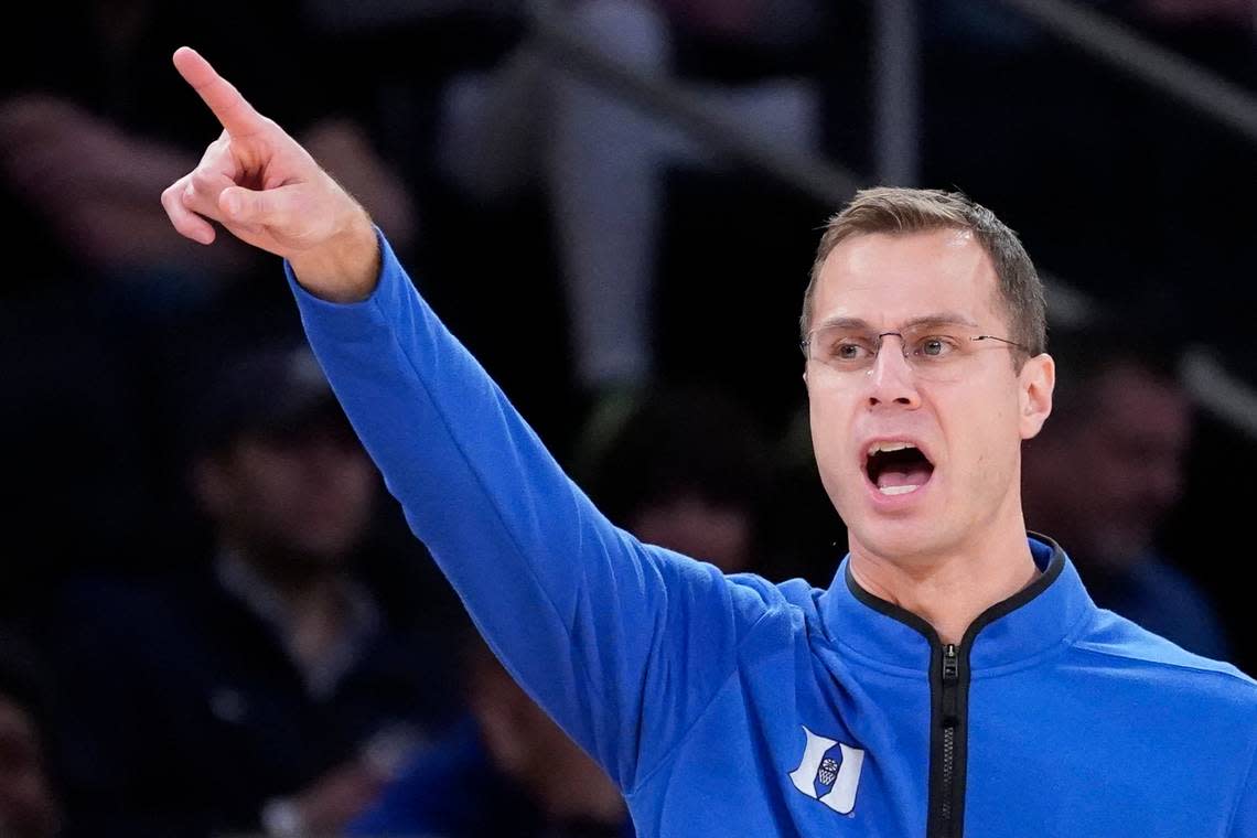 Duke head coach Jon Scheyer works the bench during the second half of the team’s NCAA college basketball game against Iowa in the Jimmy V Classic, Tuesday, Dec. 6, 2022, in New York. (AP Photo/John Minchillo)