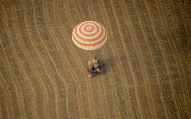 The Soyuz TMA-22 capsule carrying International Space Station (ISS) crew members U.S. astronaut Daniel Burbank and Russian cosmonauts Anton Shkaplerov and Anatoly Ivanishin, lands in Kazakhstan, some 88km (55 miles) north-east of Arkalyk, April 27, 2012.