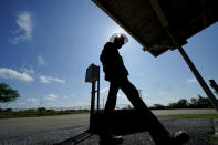 Cameron County Irrigation District #2 pump station supervisor George Diego, walks past a measuring site, Wednesday, Sept. 15, 2021, in San Benito, Texas. Earlier this year, before rain soaked the Rio Grande Valley in May and June, several sugarcane farmers in Irrigation District #2 were told they could only be provided one delivery of water — far less than what the thirsty crop requires. (AP Photo/Eric Gay)