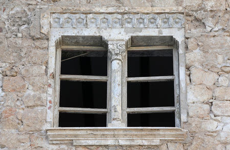 A window of a historic building, that was damaged during a three-year conflict, is seen in Benghazi, Libya February 28, 2018. REUTERS/Esam Omran Al-Fetori