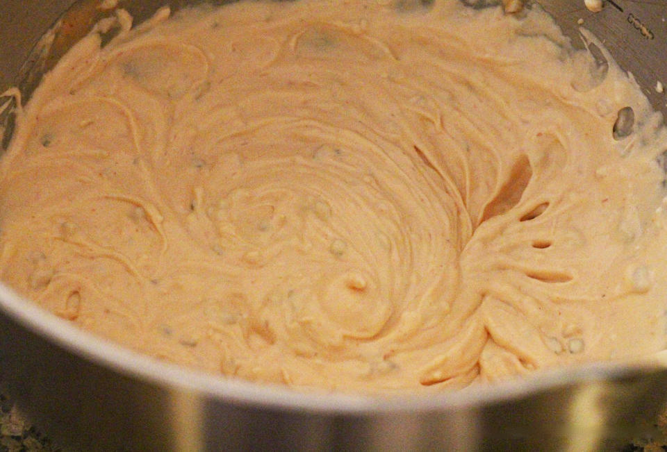 <p>Preheat the oven to 350°F. Spritz a 1 quart baking dish with cooking spray. Set aside. In a medium-size mixing bowl use a hand mixer to cream together the softened cream cheese, mayonnaise and Thousand Island dressing until fully combined. </p>