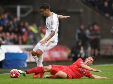 Britain Football Soccer - Swansea City v Liverpool - Barclays Premier League - Liberty Stadium - 1/5/16 Liverpool's Cameron Brannagan in action with Swansea's Kyle Naughton Reuters / Rebecca Naden Livepic